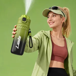 Gradient green sports spray water bottle with straw and double drinking port for fitness.
