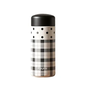 Portable mini thermos water bottle with chic black and white polka dot and plaid pattern design.