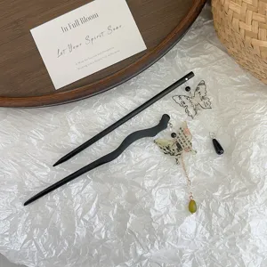 Elegant Chinese style black hair sticks featuring butterfly charms and long green tassels