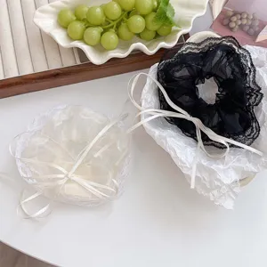 Chouchous élégants en maille de dentelle avec longs nœuds en ruban pour coiffure.
