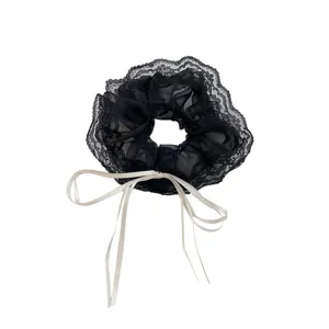 Chouchou élégant en dentelle noire avec long nœud en ruban crème pour filles et femmes