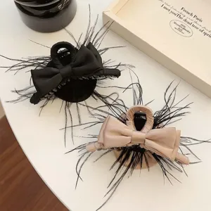 Elegant French style satin bow hair claw clips with feather accents in black and beige