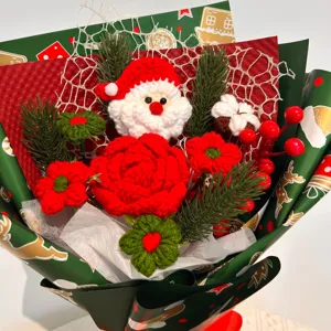 Handcrafted crochet Christmas bouquet close-up showing Santa Claus and red rose details.