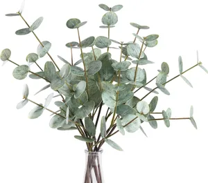 Detail view of artificial eucalyptus leaves branch, realistic green foliage for home decoration.