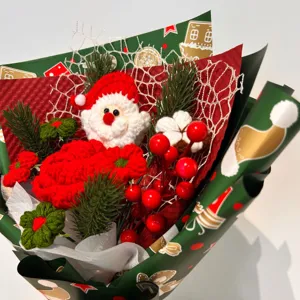 Handmade crochet Christmas flower bouquet finished product with Santa Claus berries.