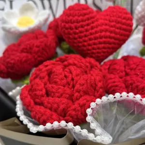 Handmade crochet red rose flower bouquet with heart and pearls for Valentine gift.