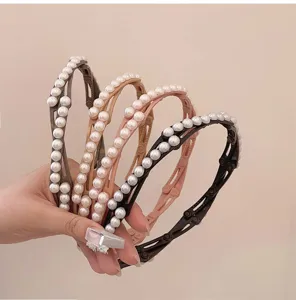 Close-up of four colors of elegant folding pearl headbands with non-slip teeth