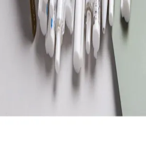Detailed view of white pens and stationery accessories for canvas pencil case storage use.