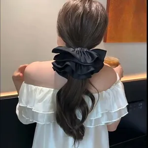 Large black French style satin ruffled scrunchie hair tie for elegant ponytails and buns