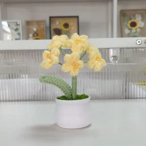 Handmade crochet yellow flower potted plant detail view, lovely desktop decor and gift.