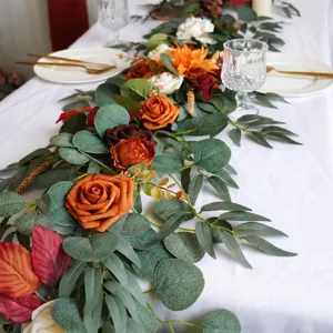 Artificial rose flower vine garland for wedding party table decor and event floral arrangement.