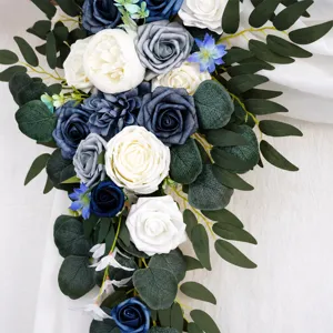 Artificial wedding arch flower detail featuring blue and white roses with eucalyptus leaves.
