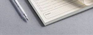 Daily planner notebook with todo list checkboxes and summary section for office study use.