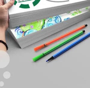 Close-up detail of thick DIY craft paper cardstock and colorful pens for art drawing.