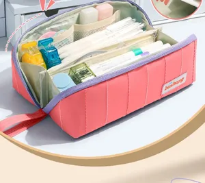 Multi-layer large capacity pink pencil case detail showing interior mesh and pen slots.