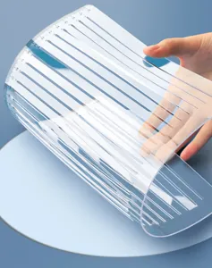 Transparent exam grid ruler detail showing precise measurement slots and clear scale markings on material.