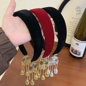 Ethnic style velvet headbands with gold and silver bell tassels in black and red