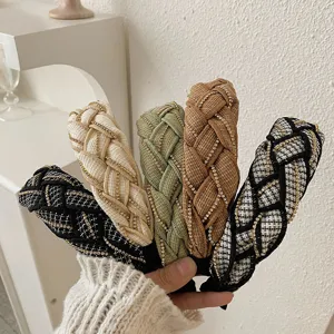 Detailed view of braided tweed headbands with elegant rhinestone chain embellishments