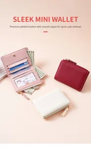 Detail view of premium pebbled leather mini wallet with smooth zipper and multiple card slots.