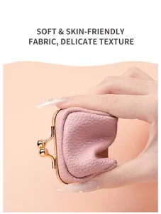 Details of the mini soft leather kiss lock jewelry pouch showing delicate texture.