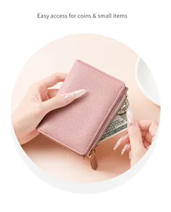 Pink pebbled leather short wallet detail showing coin zipper pocket and multiple card slots.