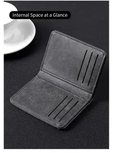 Detailed close-up view of the minimalist black leather card holder interior structure.
