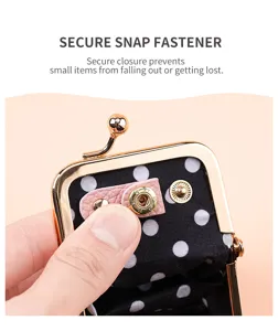 Mini kiss-lock coin purse with secure snap fastener, polka dot lining for jewelry ring storage.