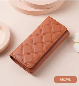 Close-up view of the brown long wallet showcasing classic diamond quilted pattern and neat tri-fold design.