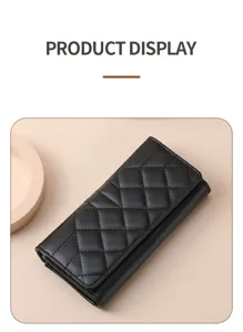 Black quilted long wallet for women, classic tri-fold design with large capacity and phone pocket.