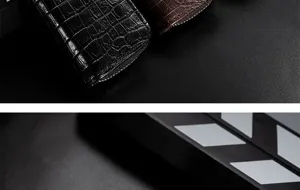 Close-up details van de krokodillenpatroon rits sleuteletui, met premium leertextuur.