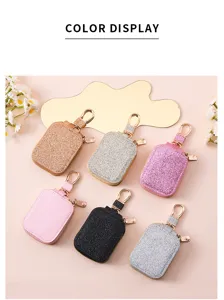 Custodia protettiva glitterata per auricolari wireless con gancio portachiavi elegante.