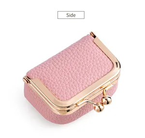 Mini pink kiss-lock jewelry box side detail, compact ring and coin purse case display.