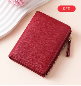 Red textured leather women short wallet with multiple card slots and zipper pocket.