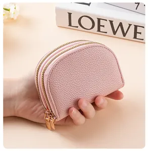 Close-up of pink double zipper coin purse, premium textured PU leather card holder.