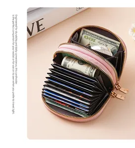 Detail shot of the pink double zipper accordion card holder showing ample multi slot card capacity.