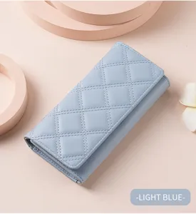 Close-up detail of the light blue quilted long wallet featuring classic diamond stitching and flap.