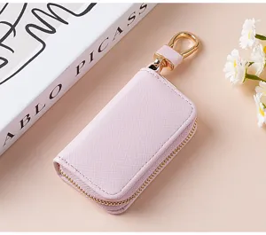 Astuccio portachiavi per auto in pelle rosa con gancio dorato elegante e pratico accessorio