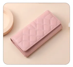 Elegant pink quilted long wallet for women, tri-fold design with large capacity and phone pocket.