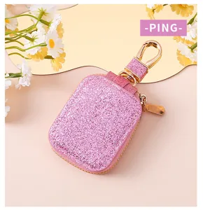 Elegante custodia per cuffie glitterata con pratico portachiavi in metallo per uso quotidiano.