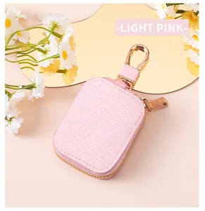 Custodia protettiva in paillettes rosa per auricolari wireless con comoda cerniera.