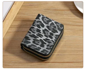 Leopard print short women coin purse with double zipper design, compact wallet card holder detail view.