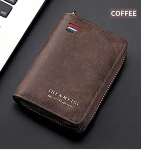 Detailed close-up view of brown vintage leather men's zipper key wallet and coin purse.