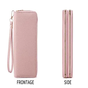 Detailed view of the pink double zipper women long wallet, featuring card slots and wrist strap.