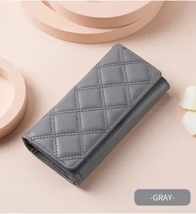 Grey quilted long wallet detail showing texture, multiple card slots, and snap closure.