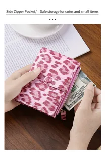 Detailed view of the pink leopard print short wallet featuring a convenient side zipper pocket.
