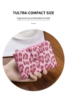Close-up of pink leopard print women short wallet, compact size with multiple card slots.