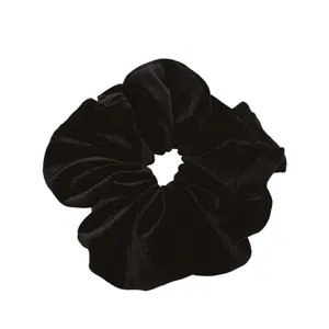 Elegant black velvet scrunchie hair tie with soft texture on white background