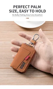 Porte-clés de voiture compact en cuir marron avec fermeture éclair et crochet en métal.