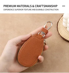 Detailed view of the premium brown leather car key case showcasing fine texture and durable zipper.