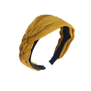 Wide mustard yellow braided fabric headband with handmade knot design for women's hair